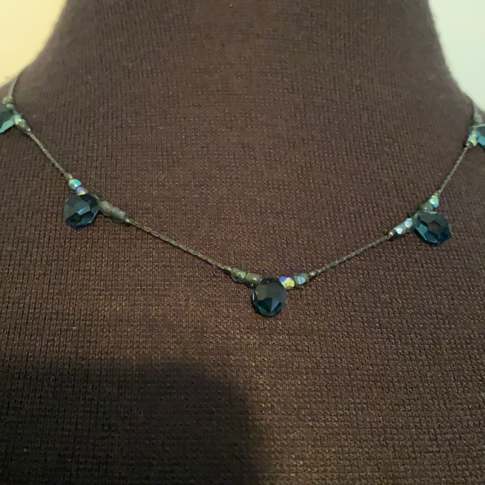 Fun necklace bluish/turquoise colored stones.